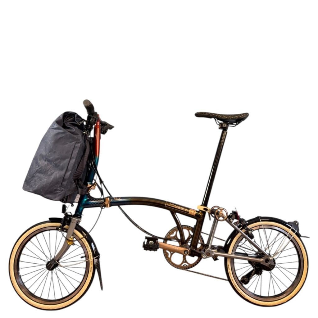 THE URBAN TRAVELLER 22 THE URBAN TRAVELLER on the front carrier block of a Brompton folding bike