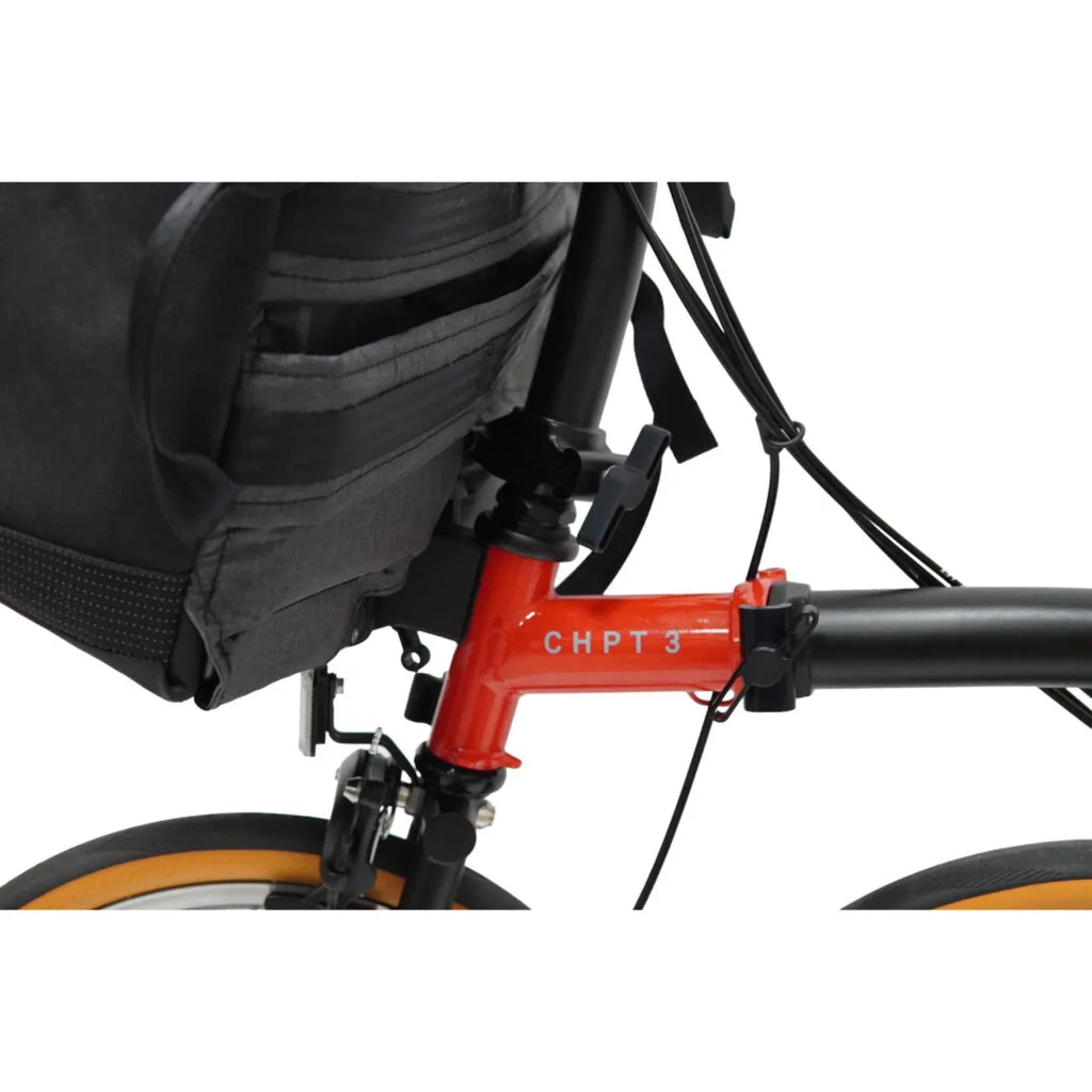QUER on the front carrier block of a Brompton folding bike, close-up from below