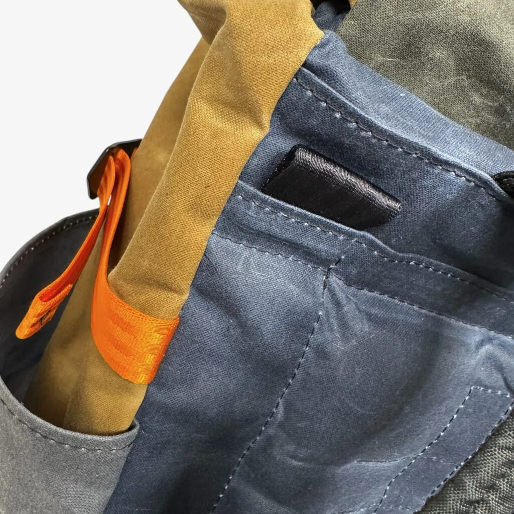 Flap on the back of THE PRO that holds the shoulder straps while riding