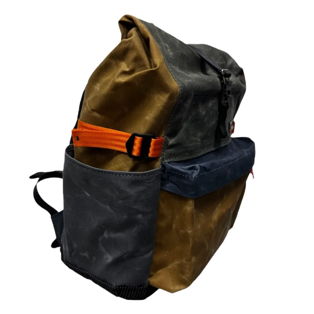 Open slip pocket on the side of THE PRO, compression strap above